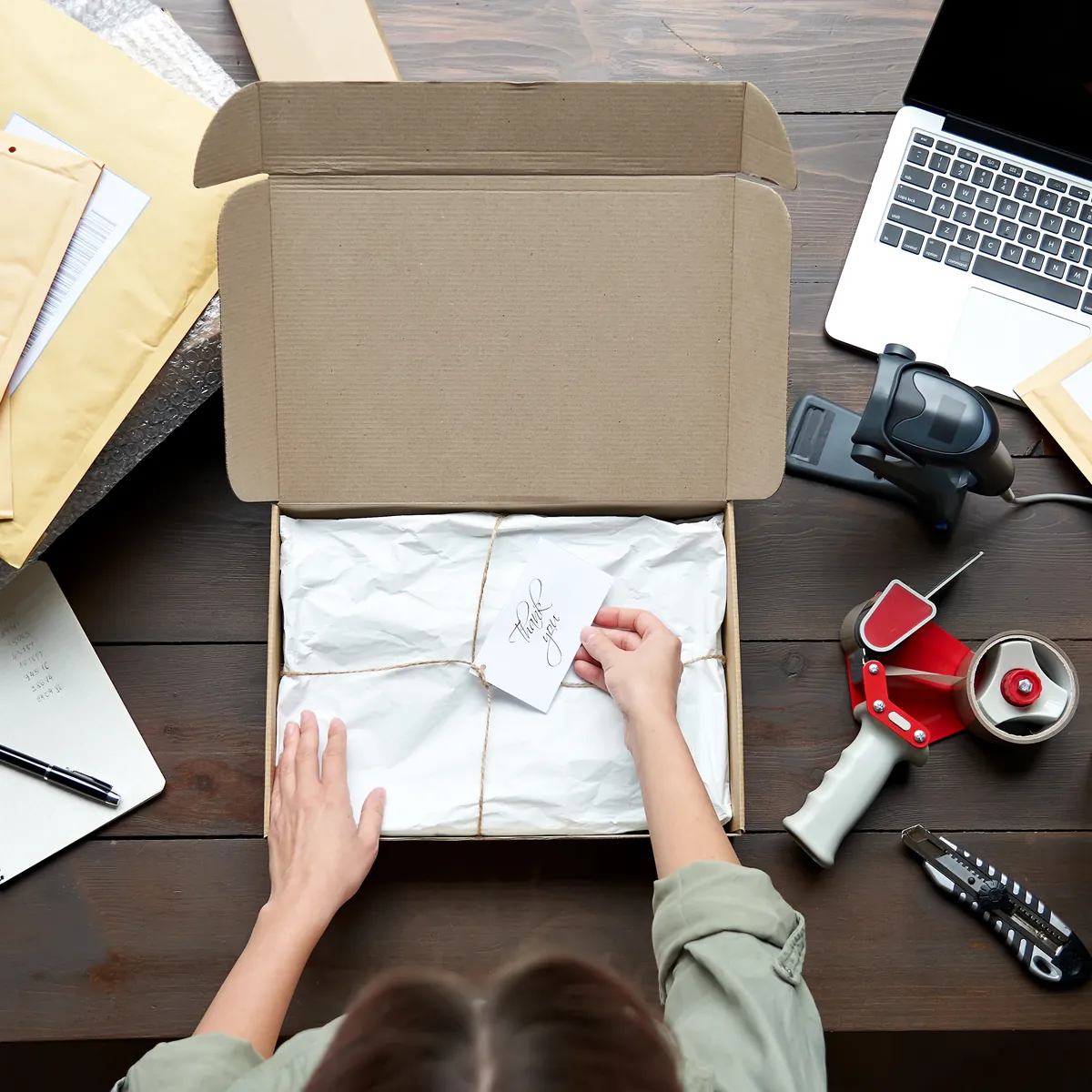 An overhead view of a small business packing online orders